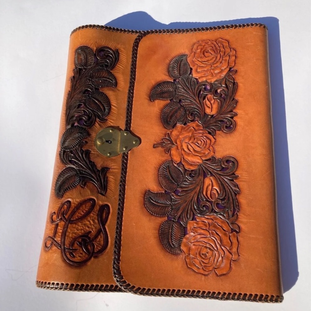 Ray Pohja hand carved leather portfolio